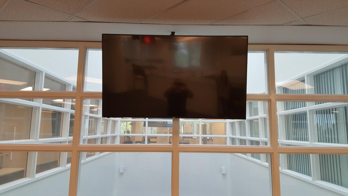 TV mounted from ceiling